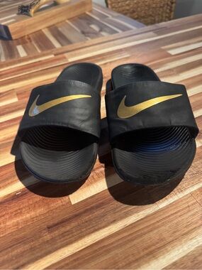 Nike Black Slide Sandals with Gold Swoosh - Kids